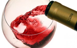A68A43 Pouring red wine into glass CUT out cutout